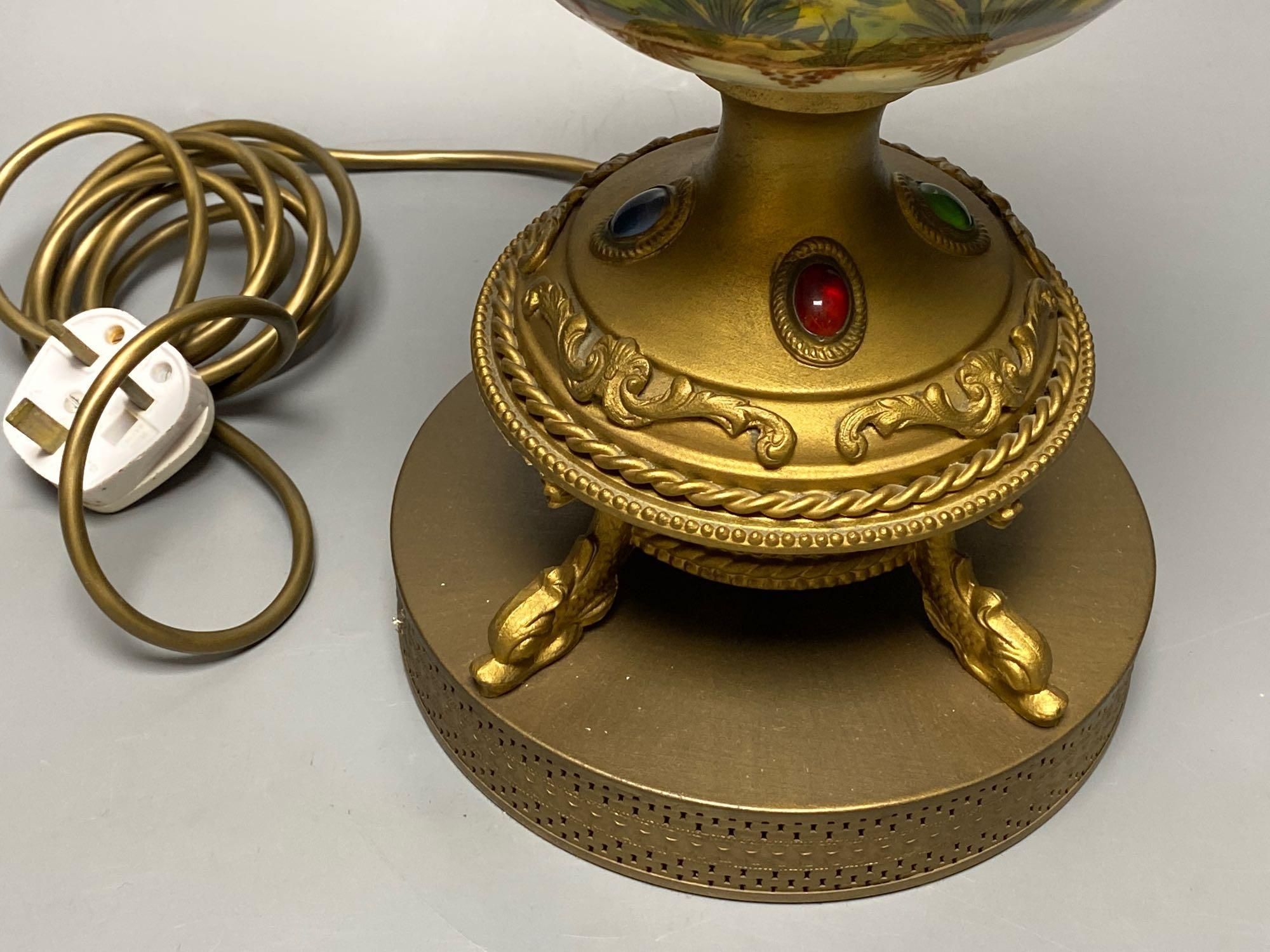 A gilt lamp stem incorporating relief-moulded body, 46cm